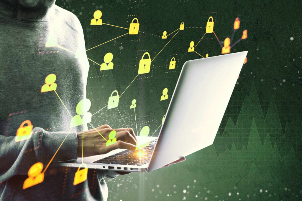 side-view-of-hacker-using-laptop-with-forex-chart-BSA9QUN.jpg